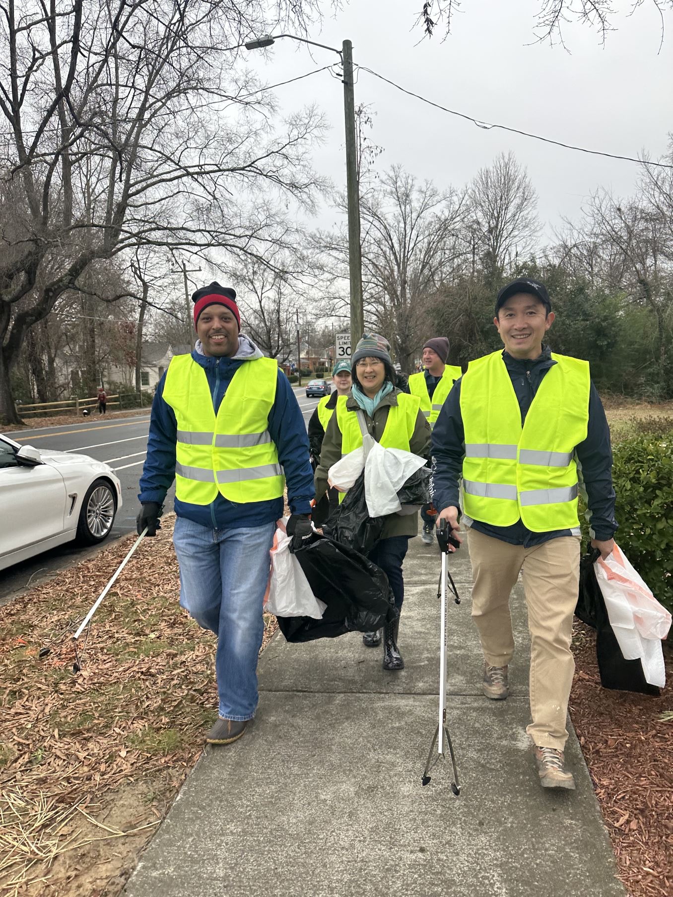 DEI committee volunteers walking down sidewalk during MLK Day 2024