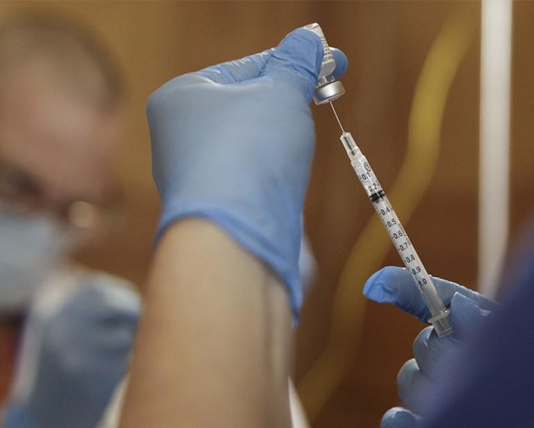 Drawing vaccine from vial