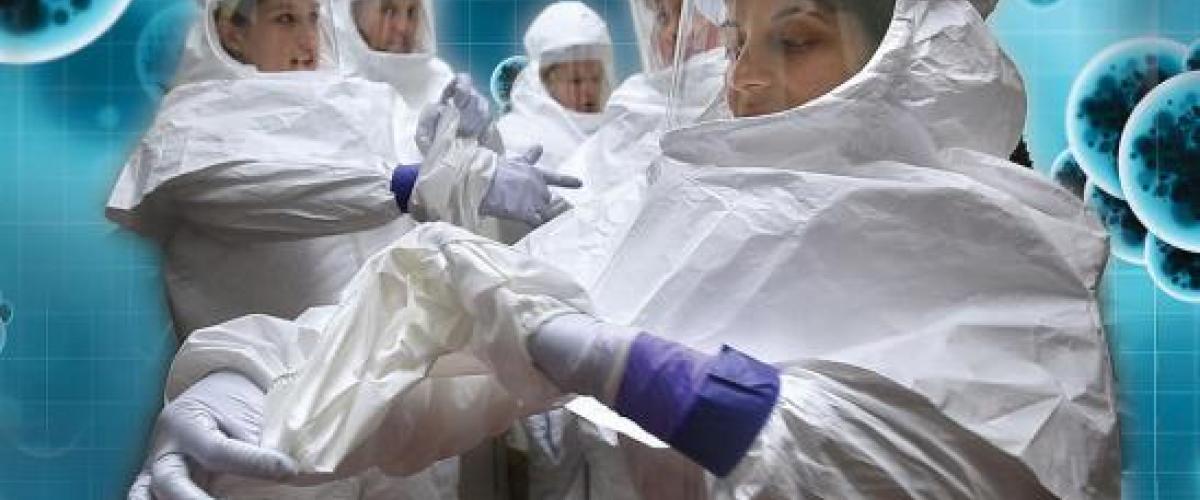 Imagery of scientists in full PPE in lab