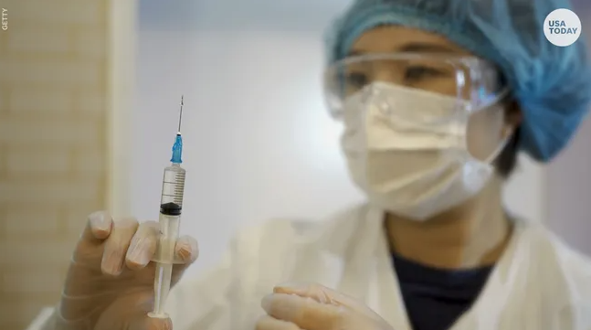 medical worker with syringe