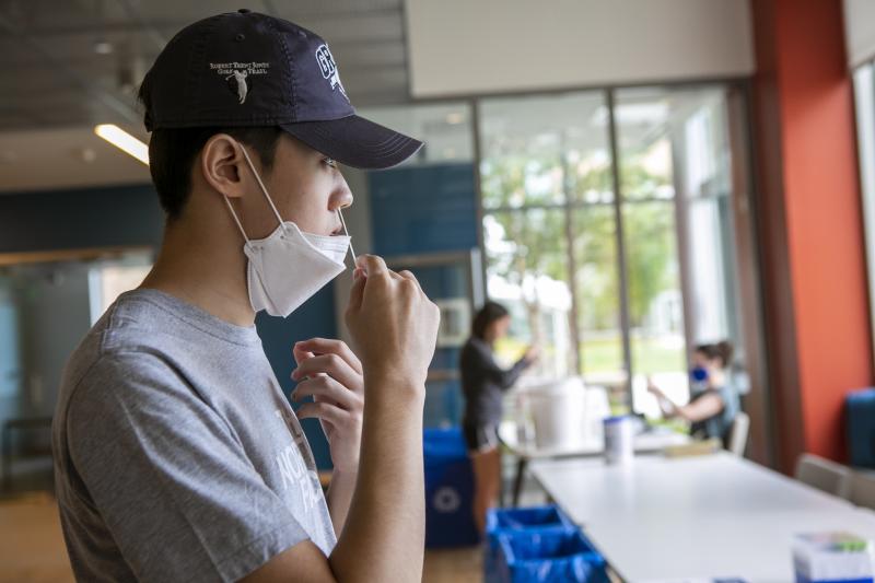 duke student doing nasal swab test for covid19